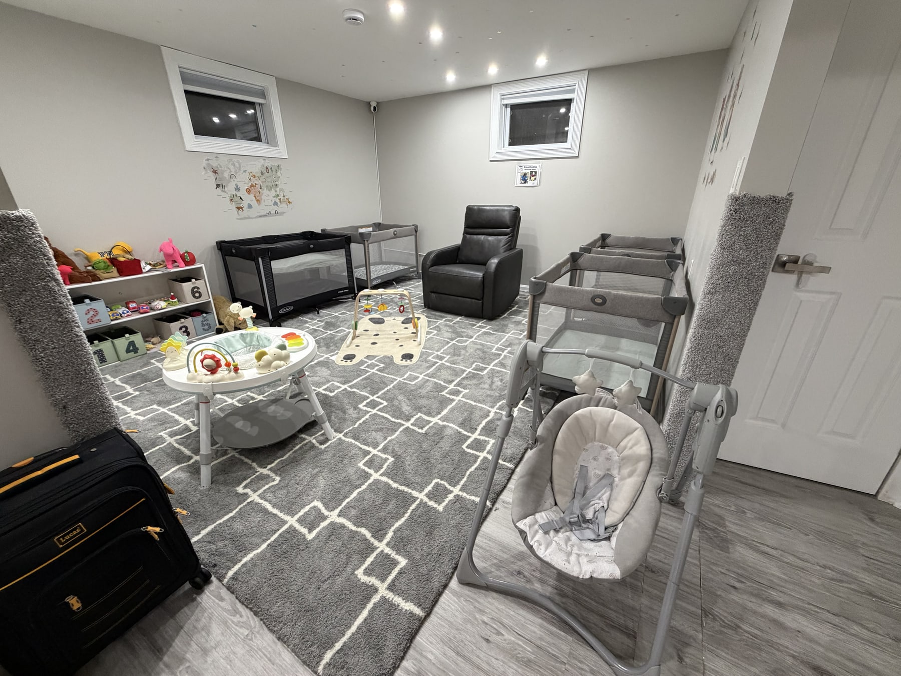The actual Bluebird Learning Nest infant napping area with individual sleep spaces, a care chair, and infant materials